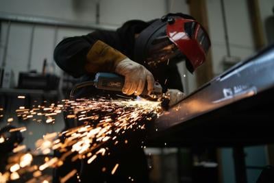 TCS - manufacturing, factory worker using grinder